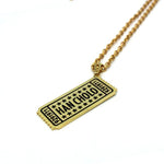 angle of the drink ticket pendant in gold from the han cholo jewelry collection
