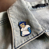 Frosta enamel pin on denim jacket