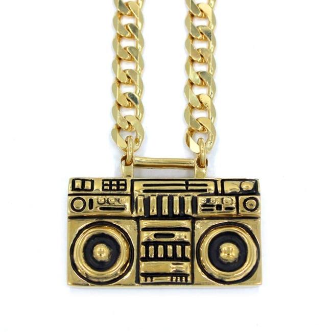 front of the Ghetto Blaster Necklace in gold from the han cholo music collection