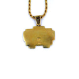 back view of the grumpy invader pendant in gold on a white background
