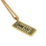 angle of the drink ticket pendant in gold from the han cholo jewelry collection