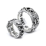 angled view of both the his and hers tilld eath do us part rings