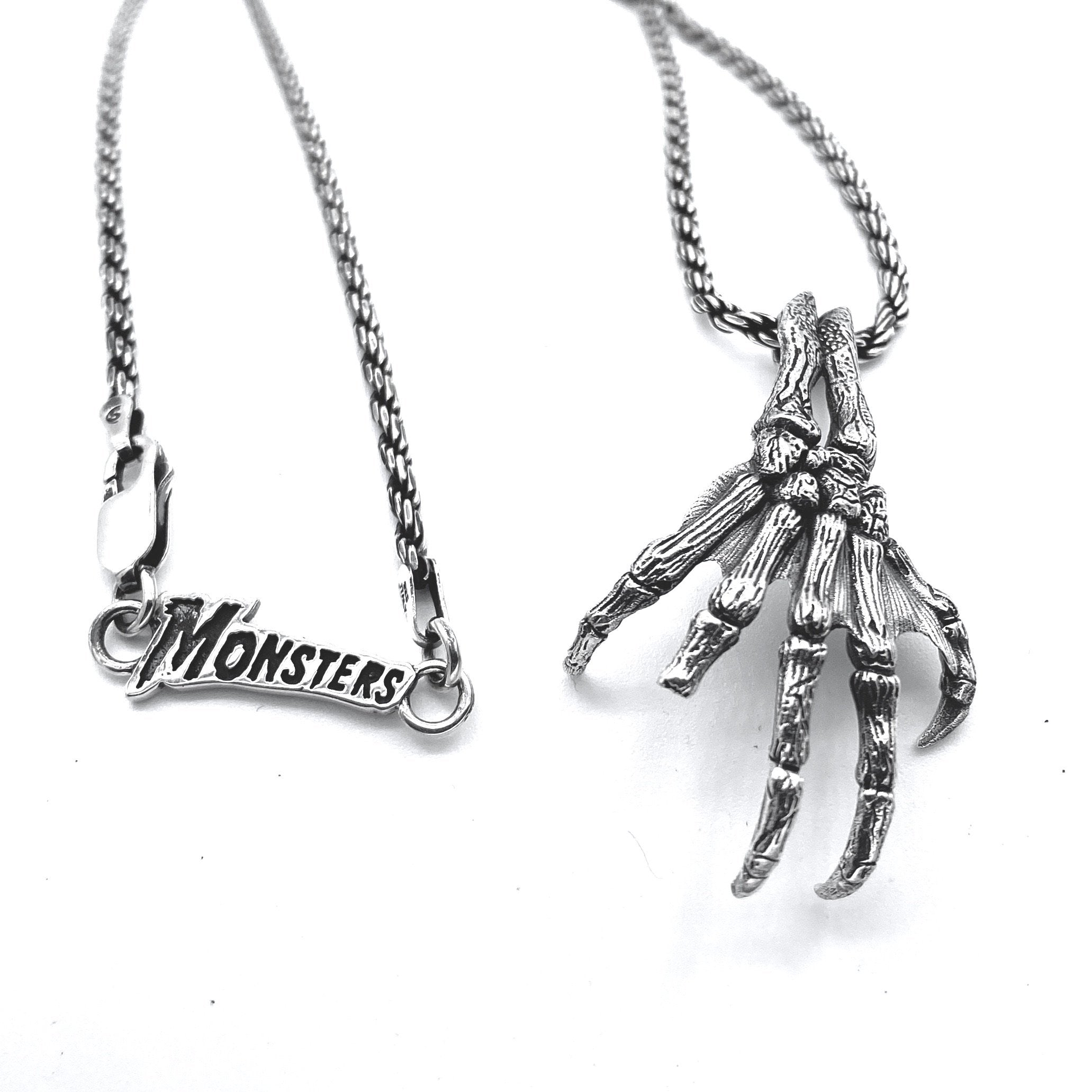 Creature Fossil Hand Necklace