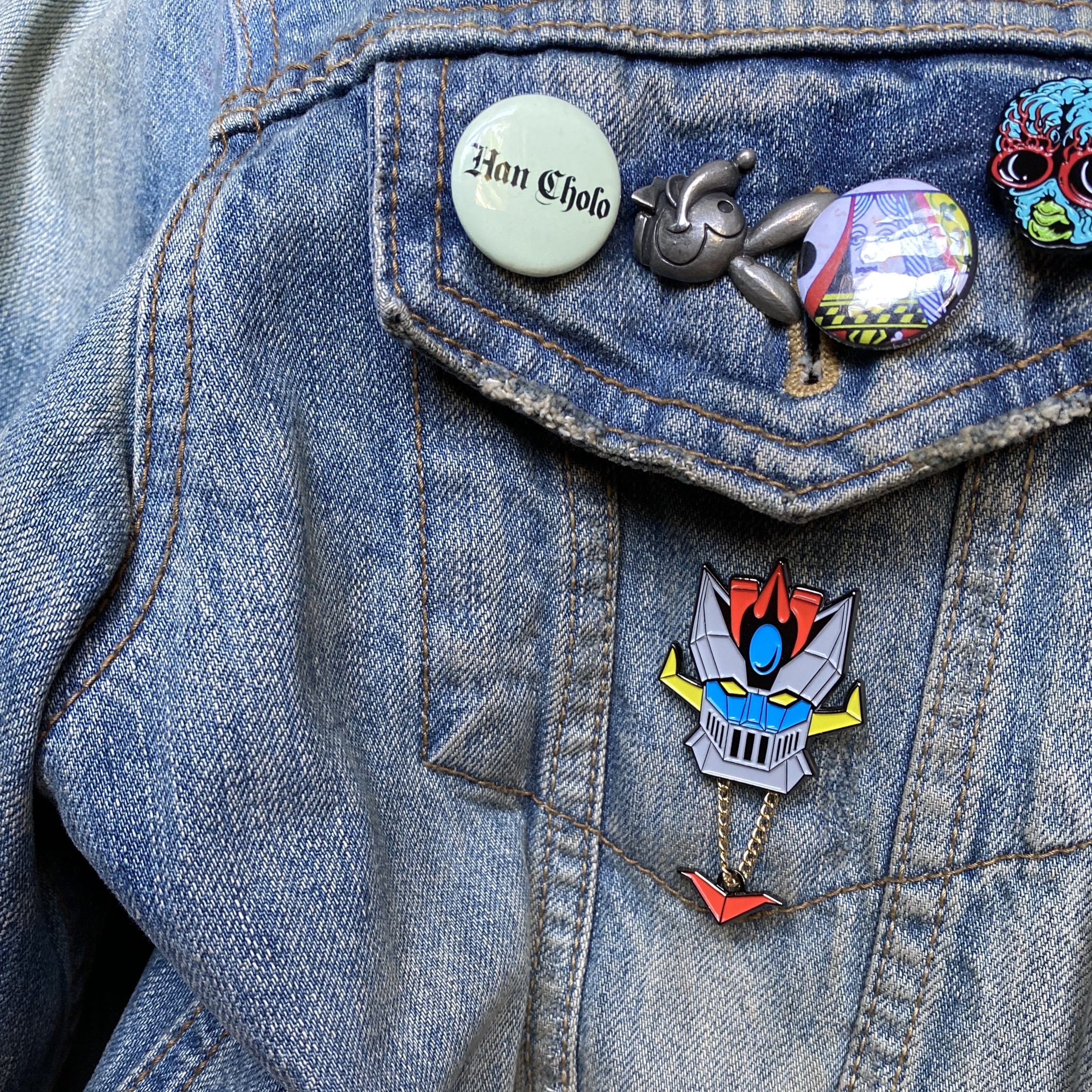 Shogun Warrior inspired Space knight enamel pin on denim jacket with pins