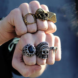 shot of a man with both fists up wearing skull rings from the han cholo skull collection
