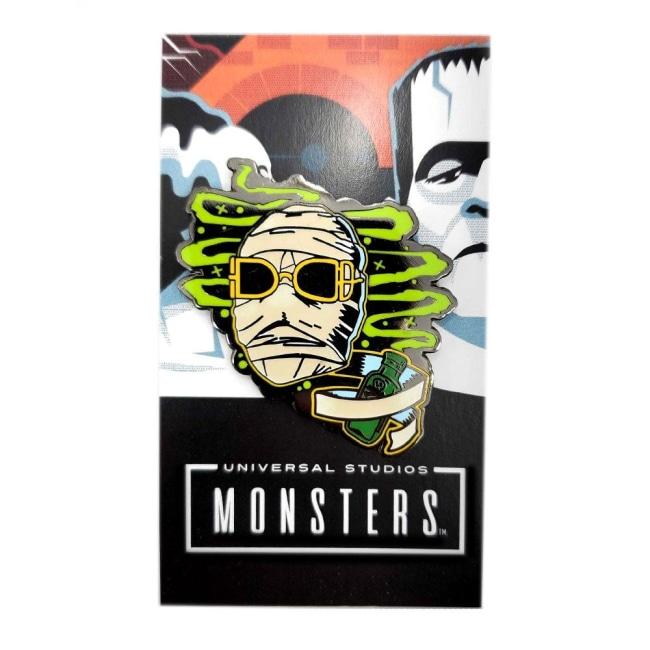 front view of the Invisible Man Enamel Pin on a Universal Monsters pin card