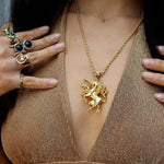 shot of a woman wearing the last unicorn pendant in gold
