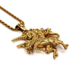 angled left view of the Last Unicorn Pendant in gold from the han cholo fantasy collection