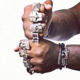 shot of king chip wearing han cholo rings for his album cover photo