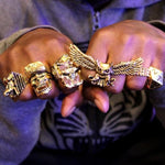 shot of a man wearing all gold han cholo rings