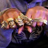shot of a man wearing all gold han cholo rings
