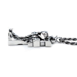 side view of the megazord pendant from the mighty morphin power rangers on a white background
