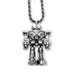silver megazord pendant from the mighty morphin power rangers laying flat on a white background