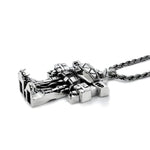 3/4 view of the megazord pendant from the mighty morphin power rangers on a white background