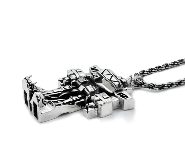 3/4 view of the megazord pendant from the mighty morphin power rangers on a white background