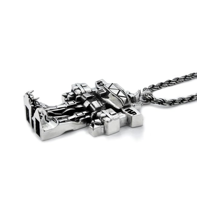 3/4 view of the megazord pendant from the mighty morphin power rangers on a white background