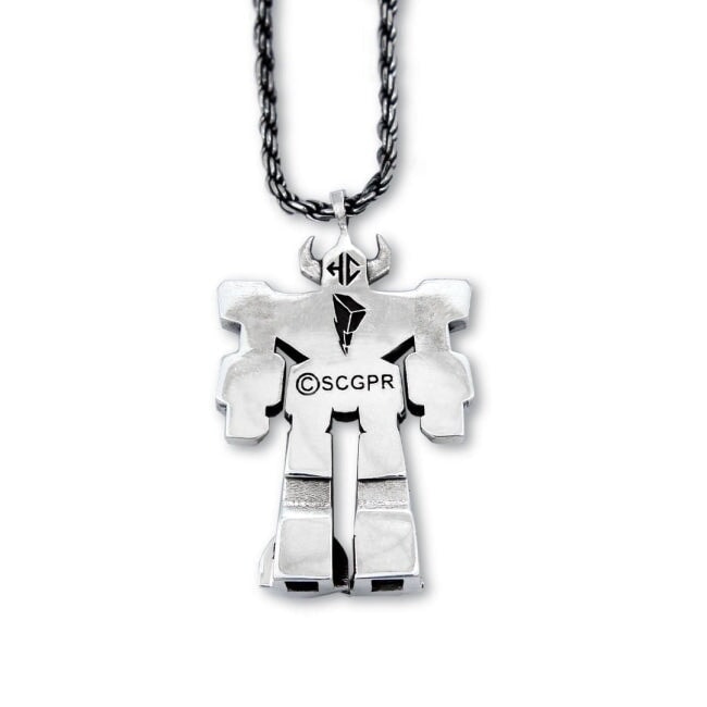 back view of the megazord pendant from the mighty morphin power rangers on a white background