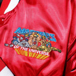 shot of the MOTU Heroes Patch on a red bomber jacket from the masters of the universe collection