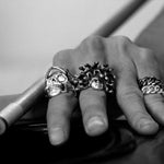 shot of a man playing pool wearing the medusa ring