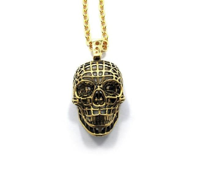 front of the Mesh Skull Pendant in gold from the han cholo skulls collection