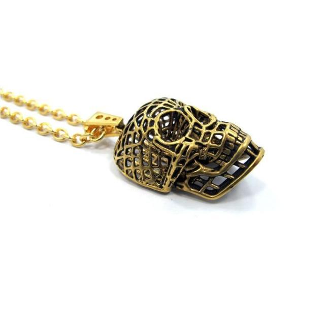 side of the Mesh Skull Pendant in gold from the han cholo skulls collection