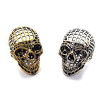 shot of the mesh skull ring in silver and gold from the han cholo skulls collection