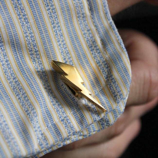 shot of the Mighty Morphin Power Rangers Cufflinks in gold on a striped shirt