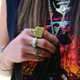 shot of a woman wearing a rock tee wearing the moon ring and hc grill ring