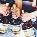 shot of people partying with hennessy bottle wearing the open space ring