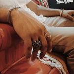 shot of a man wearing the open space ring in gold and the galaxy ring