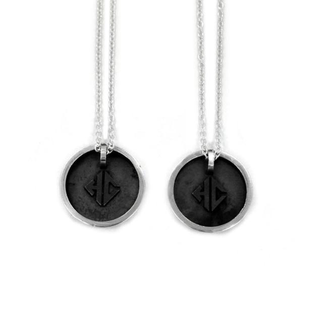 back view of the Player 1 player 2 necklaces on a white background