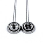 up close view of the Player 1 player 2 necklaces on a white background