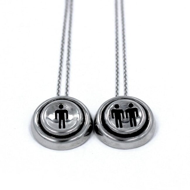 up close view of the Player 1 player 2 necklaces on a white background