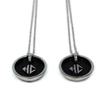 back side view of the Player 1 player 2 necklaces on a white background