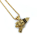 left angled shot of the Ray Gun Pendant in gold on a white surface