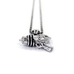 right up close shot of the Ray Gun Pendant in silver on a white surface