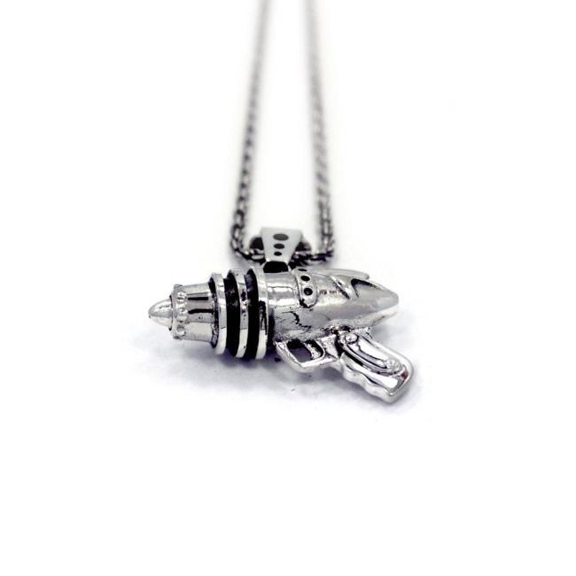 right up close shot of the Ray Gun Pendant in silver on a white surface