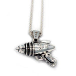 right side shot of the Ray Gun Pendant in silver on a white surface