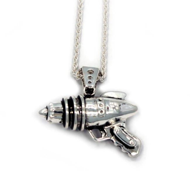 right side shot of the Ray Gun Pendant in silver on a white surface