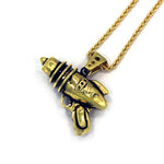 left angled shot of the Ray Gun Pendant in gold on a white surface