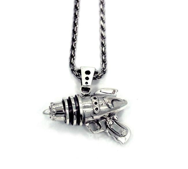 right side shot of the Ray Gun Pendant in silver on a white surface