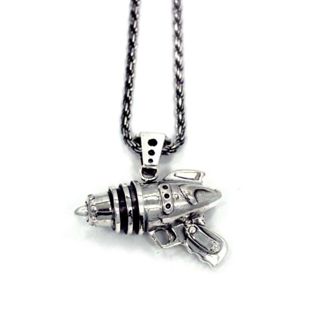 right side shot of the Ray Gun Pendant in silver on a white surface