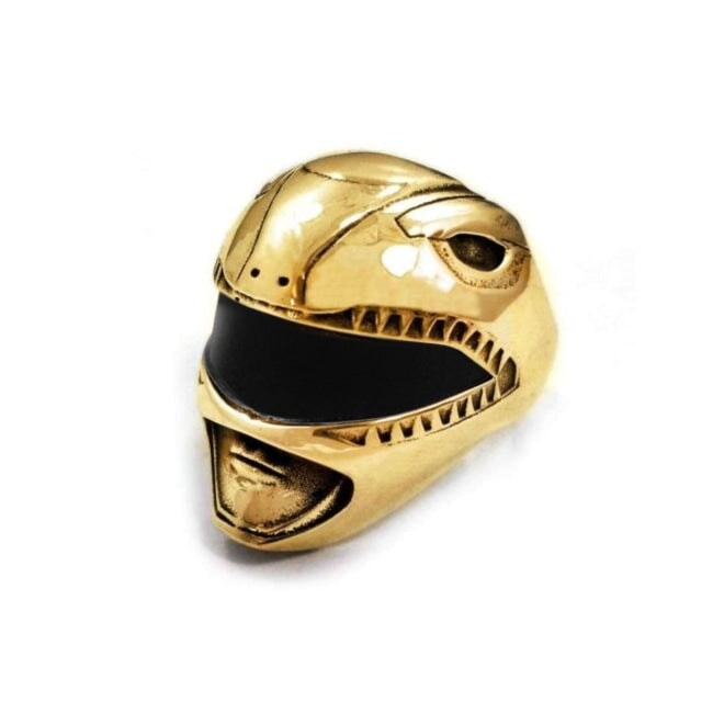 left view shot of the mighty morphin power rangers red ranger helmet ring in gold on a white surface