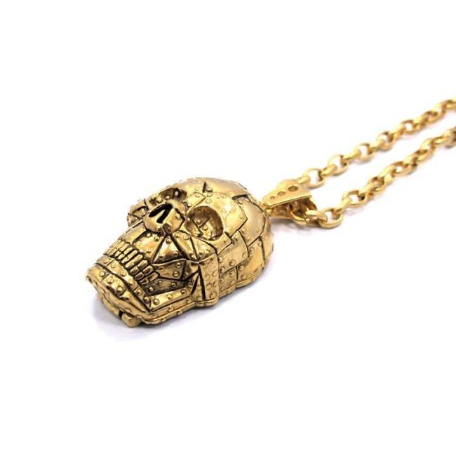 angle of the Rivet Skull Pendant in gold from han cholo skulls collection