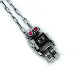 right angle view of the Robot Pendant in silver on a white background