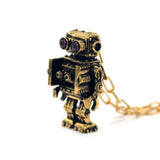 right angle view of the Robot Pendant in gold on a white background
