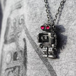 shot of the robot pendant hanging on a person in a grey robot shirt