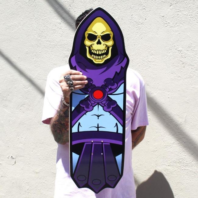 shot of a man holding the Skeletor Collectible Skate Deck Skateboard