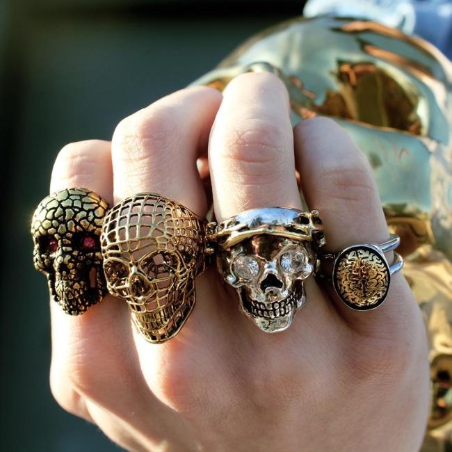 shot of a man wearing the Skull Of Zeus Ring and other skull rings from han cholo