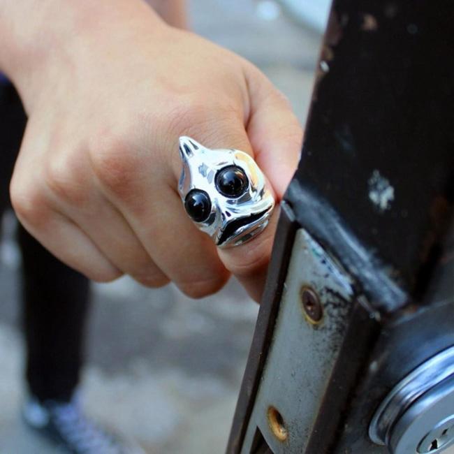 shot of a man opening a door wearing the sleezy ring in silver